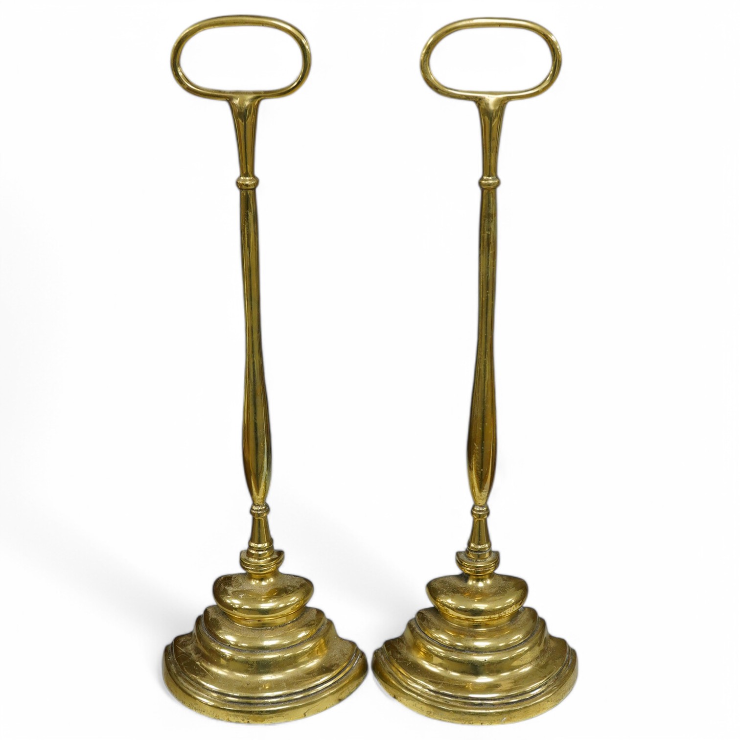 Two brass semi circular door porters, 45cm high. Condition - minor scraping to brass